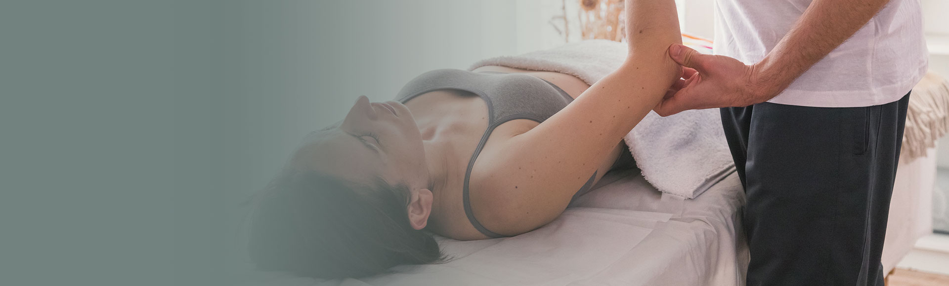 physiotherapist working on woman's elbow